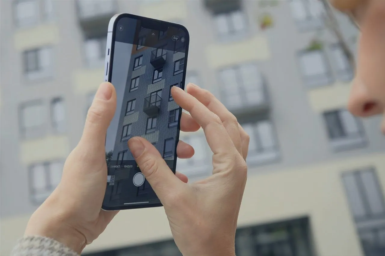 RealNex mobile app property record with comps, notes, and activity log for CRE professionals