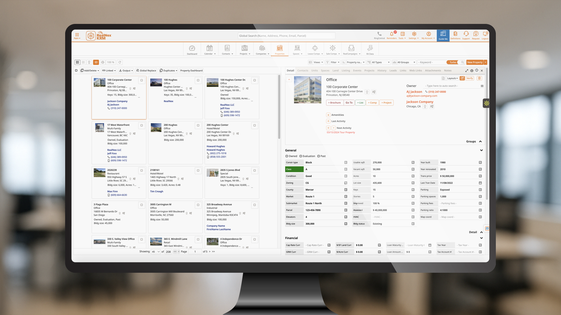 RealNex KRM property database showing linked property records and a detailed property panel