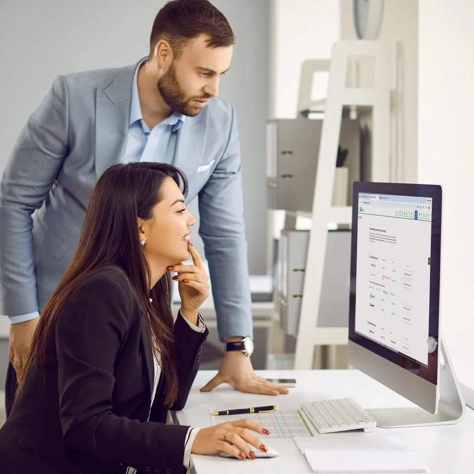 Team reviewing syndicated listings on a desktop monitor