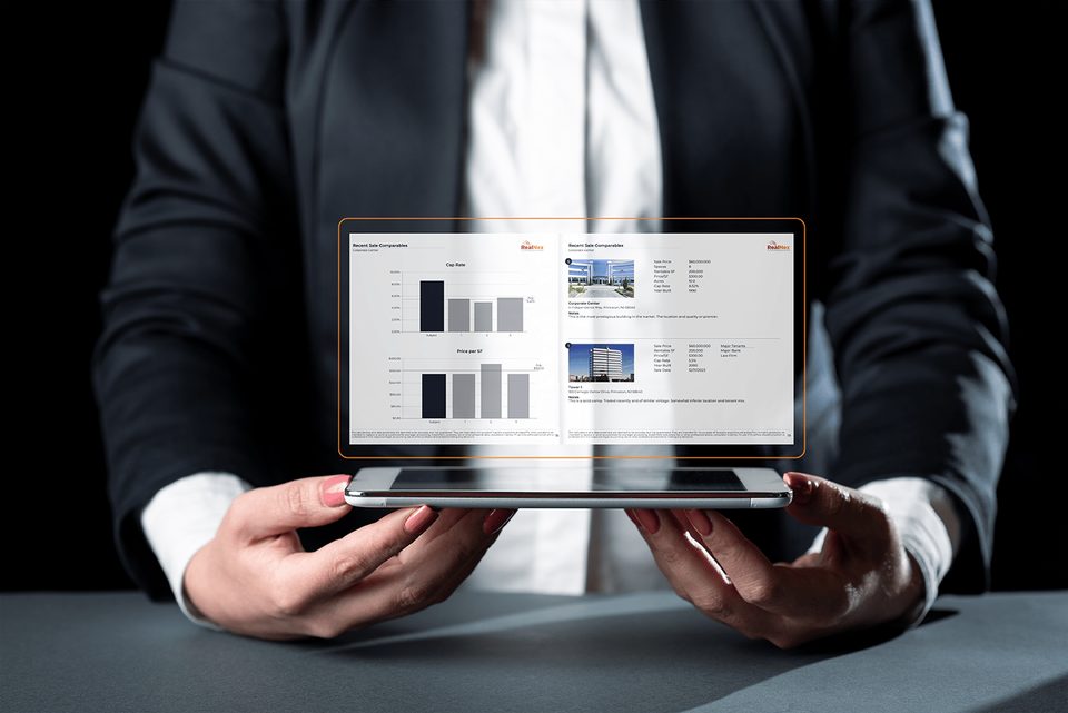 Commercial real estate research analyst using RealNex KRM to track market comps, transactions, and trends
