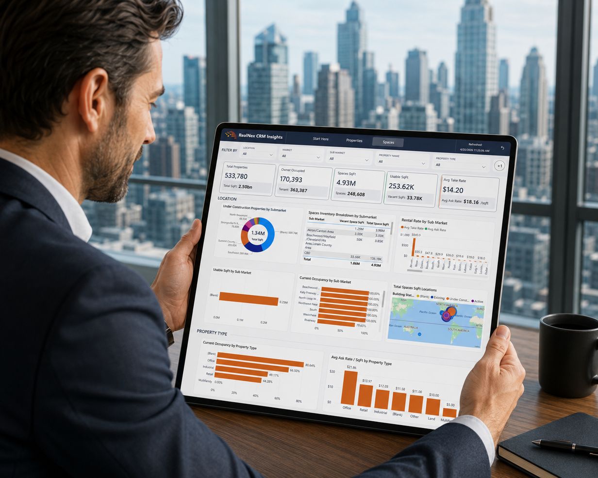 Broker analyzing property market performance data on a laptop